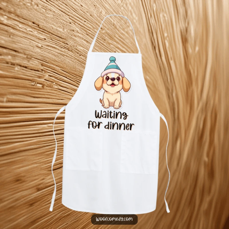 Funny dog apron featuring a dog wearing a silly hat, looking up expectantly, adding humorous charm to cooking.