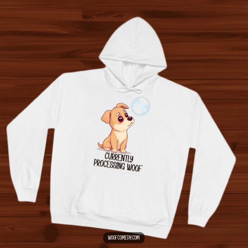 Funny hoodie with a dog tilting its head thoughtfully at a hovering bubble, exuding cozy confusion.