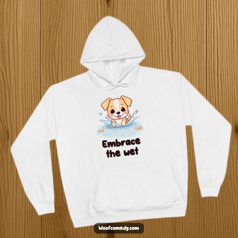 Funny hoodie with a kawaii dog playfully splashing in a puddle, ears flapping energetically, a design full of wet-doggy glee.