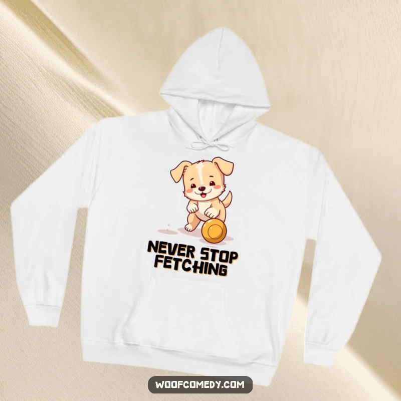 Funny hoodie showcasing a small dog with a wagging tail excitedly chasing a bouncing ball, combining warmth with playful energy.