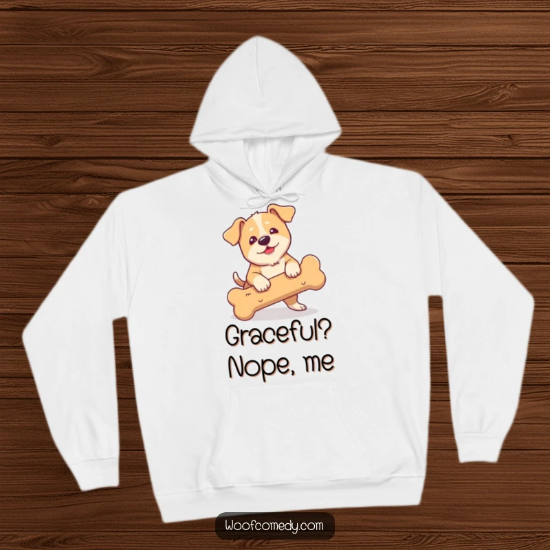 Funny hoodie featuring a floppy-eared dog comically tripping and stumbling over a huge bone.