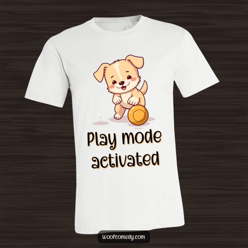 Funny t-shirt depicting a small, lively dog with a wagging tail energetically pursuing a bouncing ball, full of action.